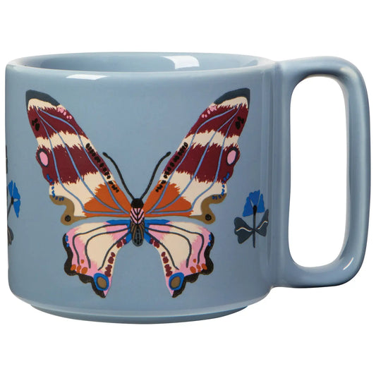 Blue mug with a colorful butterfly design on a white background